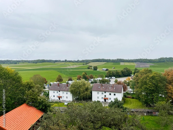Fototapeta Serene German Andechs countryside village with white houses and rolling green fields in a tranquil setting