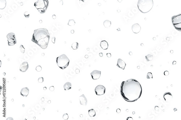 Fototapeta Raindrops in Motion: An artistic collection of pristine water droplets appears, suspended mid-air against a pristine backdrop, offering a sense of serenity and the essence of refreshment.