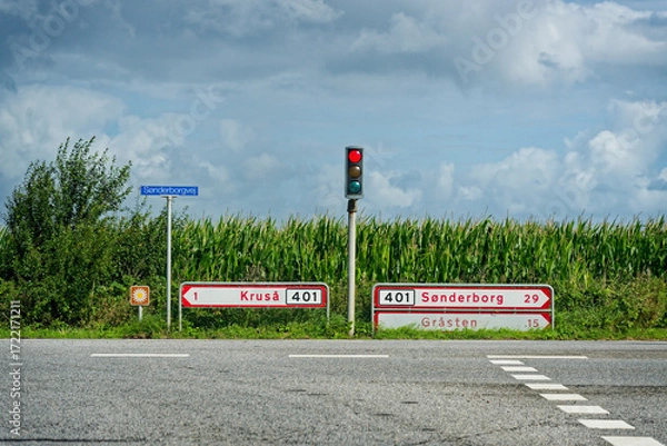 Fototapeta Cornfield with red signal and arrows to Krusa and Sonderborg
