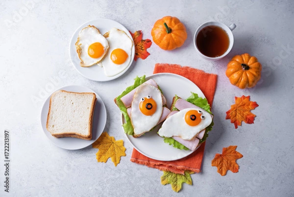 Fototapeta Sandwich with ham and fried egg in the form of ghost for Halloween holidays