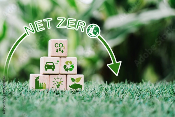 Fototapeta stack wooden cube block, pyramid shape, with green icon on blurred green nature background for Reduction of carbon emissions, carbon neutral concept. Net zero greenhouse gas emissions target