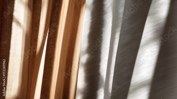 Fototapeta Soft sunlight filtering through wooden slats casting striped shadows on fabric curtain, creating textured pattern and negative space, ideal for minimal background, interior design, home decor concepts