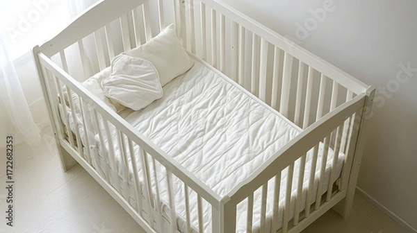 Obraz Minimalist Nursery Crib with White Bedding and Soft Natural Light