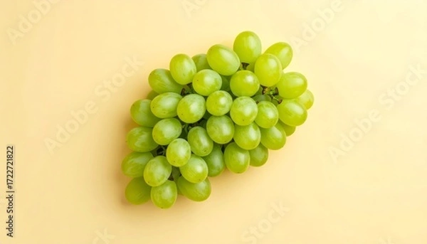 Obraz Lush green grapes display a vibrant freshness against a soft, neutral background tone.