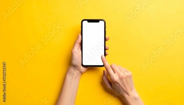 Fototapeta Smartphone in hands on a bright yellow background