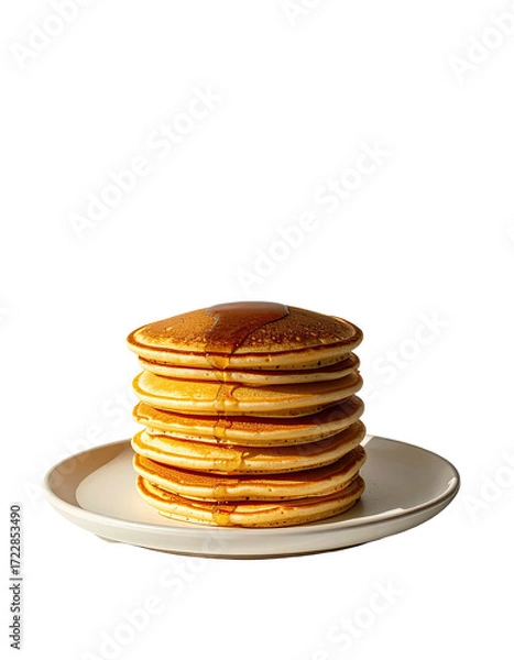 Fototapeta Stack of golden brown pancakes drizzled with syrup on a white plate