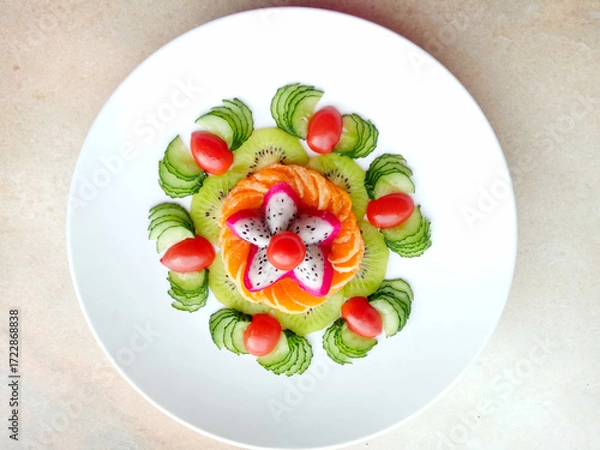 Obraz Close-up fruit platter art, cucumber, cherry tomatoes, kiwi, top view