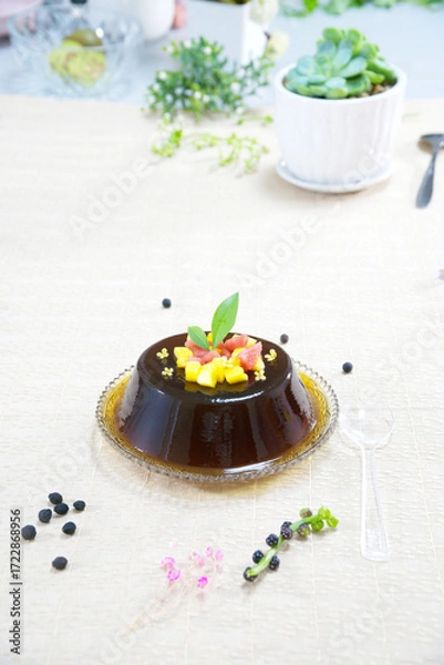 Obraz Close-up Guilinggao on a white cloth pattern, watermelon, mango, top view