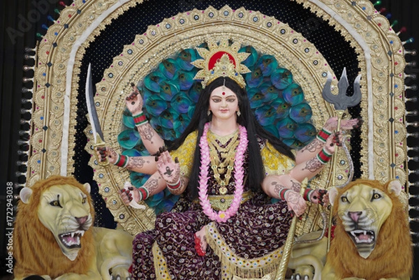Fototapeta Goddess Durga with lion statue, Hindu goddess Durga idol, Navratri festival Durga maa, Divine Durga mata sculpture stock photo.