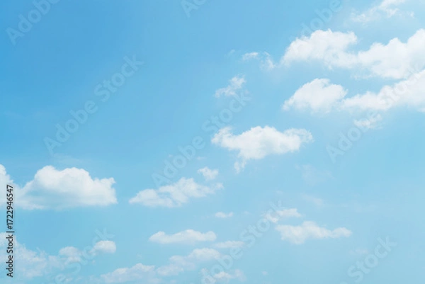 Fototapeta Beautiful clouds during spring time in a Sunny day. Blue sky and white fluffy clouds
