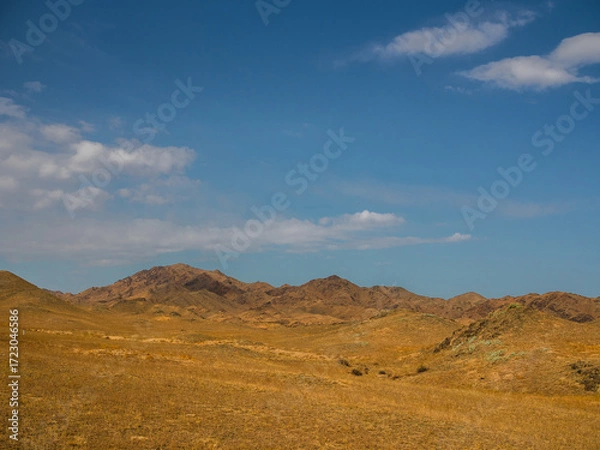 Fototapeta Mountains and sky, minimalistic landscape of the Kazakh steppe in the foothills