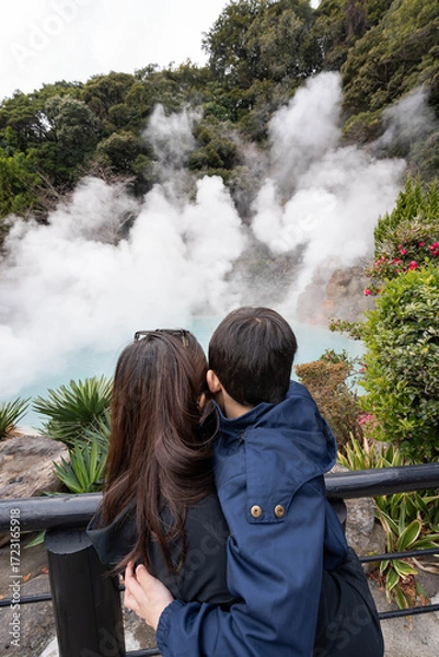 Fototapeta a mother and a child looking over the Sea Hell of Beppu, is known for its vibrant blue-colored and 98 degrees Celsius that use for cooking egg also known as Onsen Egg