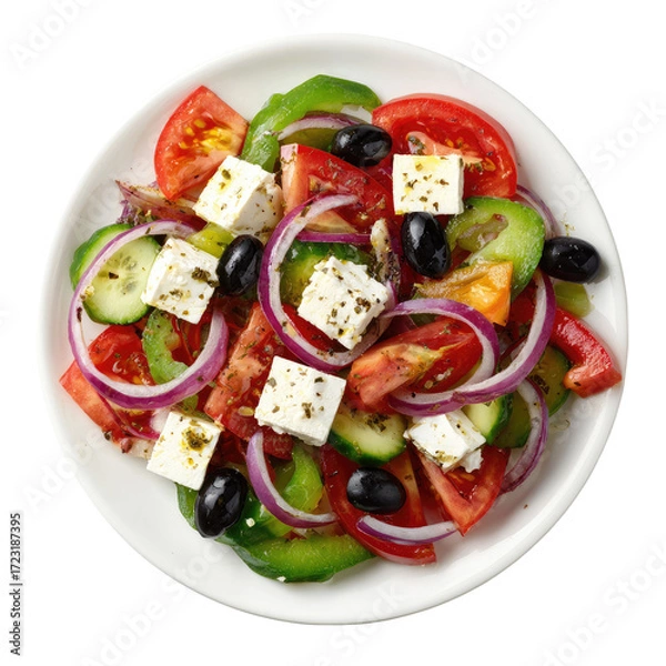 Fototapeta Overhead view of a vibrant Greek salad on a white plate, featuring feta cheese, tomatoes, cucumbers, red onions, and Kalamata olives, seasoned with herbs