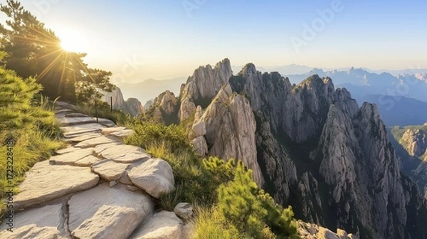 Fototapeta breathtaking view from the top of a mountain, showing an endless sea of jagged peaks
