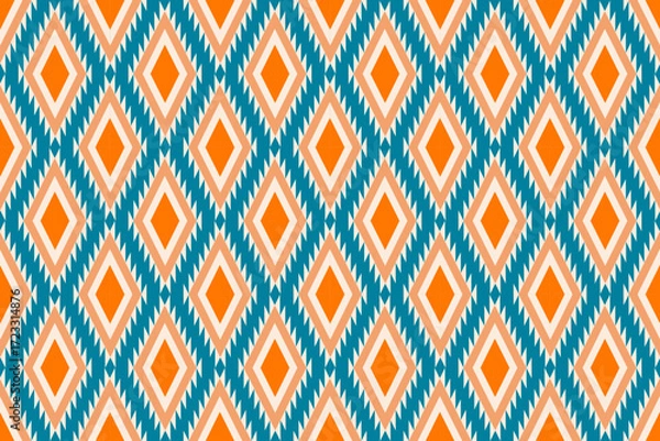 Fototapeta Colorful geometric ethnic seamless pattern with traditional tribal ornaments in orange, teal, and white. Perfect for textile design, fabric prints, wallpapers, and decorative backgrounds.