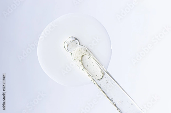 Fototapeta A sample of cosmetic serum for the face or moisturizing gel with a pipette