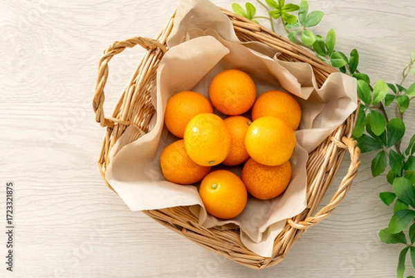 Fototapeta 新鮮な金柑と木目の背景