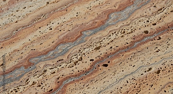 Fototapeta Close up of porous travertine stone with brown and gray layers
