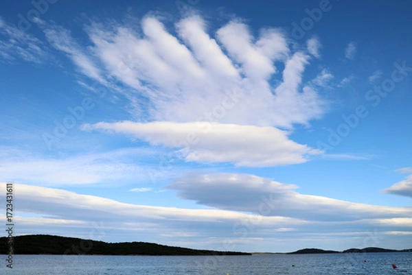 Fototapeta Unusually shaped clouds on the sea