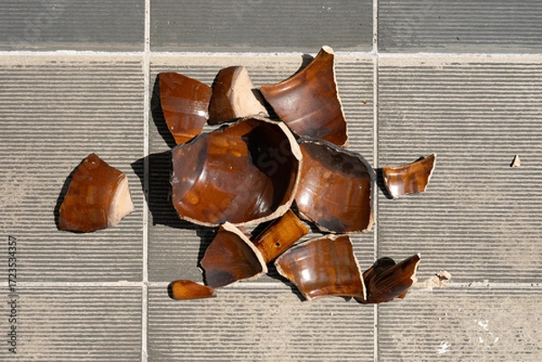 Fototapeta top view broken clay pot on the floor