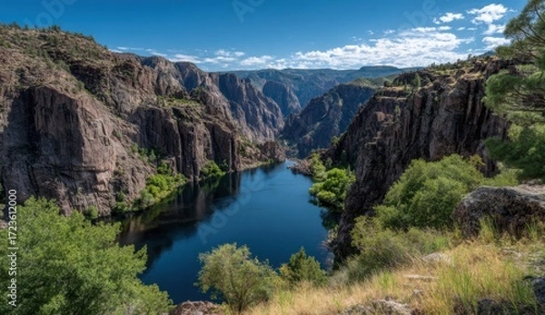 Fototapeta High-angle view of a deep canyon with a river