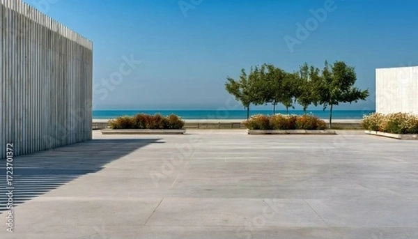 Obraz 木々と青い空のある海辺の空き地