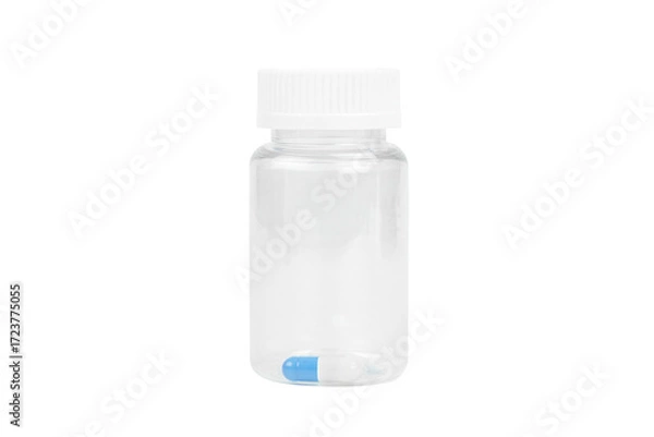 Fototapeta One blue and white capsule in a clear transparent plastic pill bottle. Concept of final dose or precision medicine, isolated on white background with clipping path.