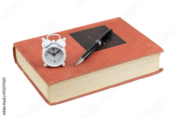 Fototapeta Vintage red book with a black pen and a small white alarm clock. Concept of study deadline, time management, and education, isolated on white background with clipping path.