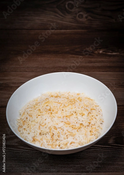Fototapeta Savor a delightful Lebanese rice dish made with fluffy rice, perfectly cooked vermicelli, and fragrant butter. Ideal as a comforting side complementing main meals