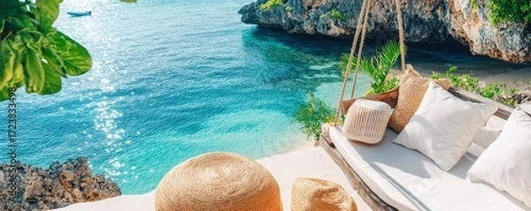 Fototapeta A serene beachside hammock setup with turquoise waters and lush greenery, perfect for relaxation and enjoying nature.