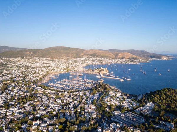 Fototapeta Bodrum, Turkey: Aerial view of the famous Bodrum beach town with its marina and ancient castle by the Aegan sea.
