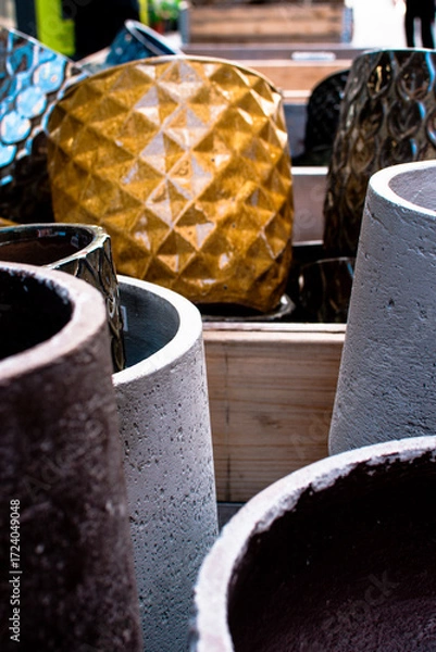 Fototapeta Colorful pots on display in a market in Denmark showcasing unique designs and vibrant colors for gardening enthusiasts