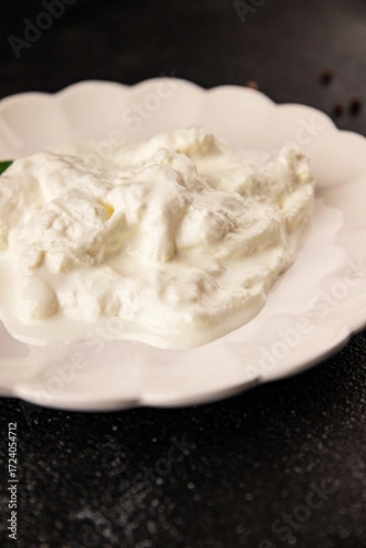 Fototapeta Stracciatella cheese soft young portion size Italian food natural product tasty snack fresh delicious gourmet food background on the table rustic top view copy space