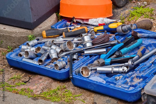 Fototapeta Scattered Hand Tools and Socket Wrenches.Pliers, Screwdrivers and Wrenches on the Ground