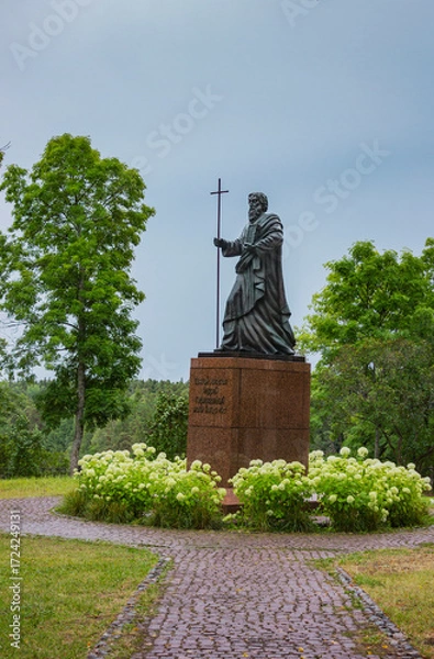 Fototapeta Valaam Monastery. Russia. Monument to St. Andrew the First-Called, on a red granite pedestal