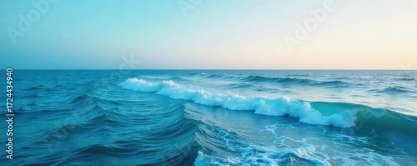 Fototapeta Vast, unbroken expanse of the ocean's surface, calm waves gently rolling under a clear sky Perfect for travel, nature, and serenity themes , serenity, sky, peaceful