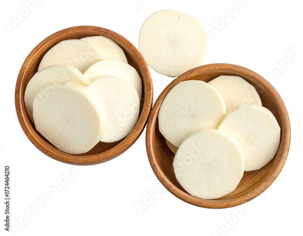 Obraz Two wooden bowls filled with sliced white root vegetable