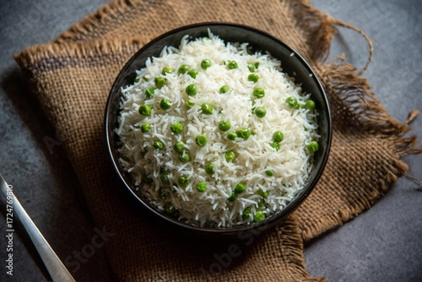Fototapeta Matar pulao or basmati rice prepared with peas served in a bowl. Close up, selective focus.