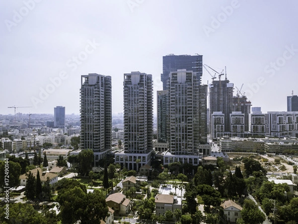 Fototapeta TEL AVIV, ISRAEL Cityscape with towers of Azrieli Center and Sarona area in Tel Aviv, . Azrieli center is the main landmark of Tel Aviv. Old and New Architecture in Tel Aviv - Old and modern bui