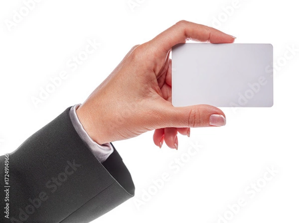 Fototapeta Woman's hand in black office suit holds empty white plastic card isolated on white background.
