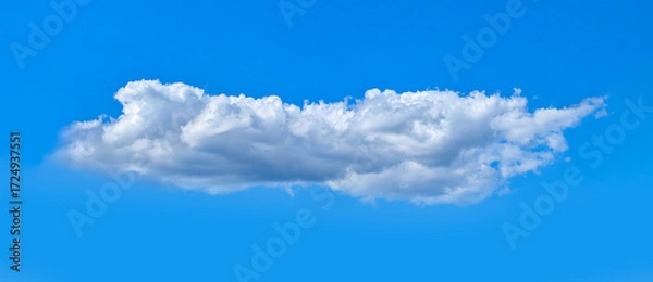 Fototapeta A big fluffy cloud with clear skies. A compound clouds slowly floats across the sky. Serenity and solitude. Calm and contemplation