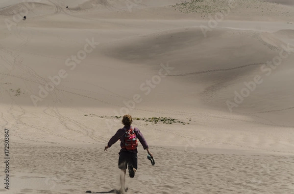 Fototapeta Running Down Dunes