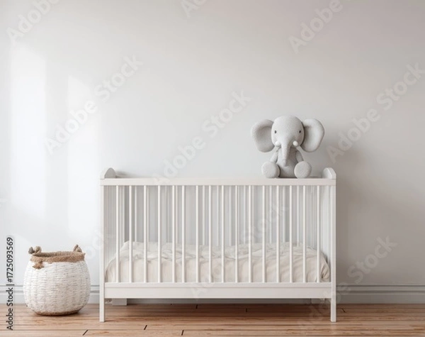 Fototapeta Simple white nursery with crib and elephant toy