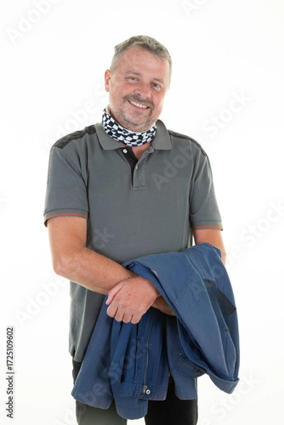 Fototapeta portrait of bearded handsome man with worker blue jacket middle age on white background
