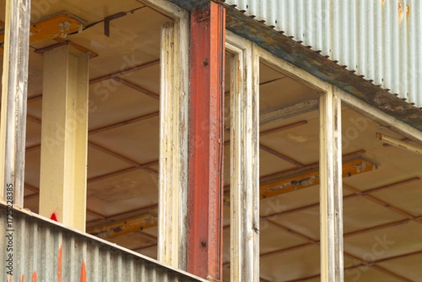 Fototapeta A large building that is currently in the process of being constructed and it features a significant number of windows throughout its design