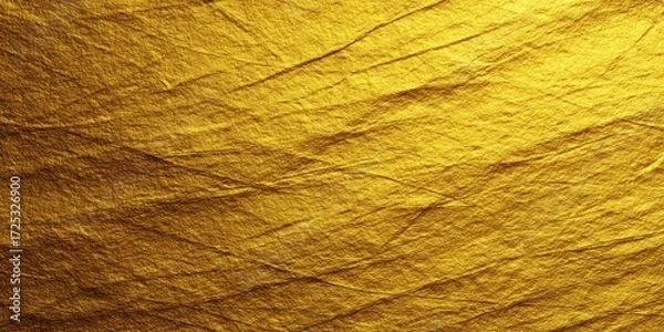 Fototapeta Metallic gold surface texture with reflective patterns.