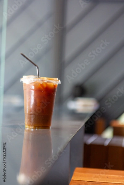 Fototapeta Cold drinks in glasses include cola, iced tea, and various other fresh, sweet beverages perfect for a cafe or bar table