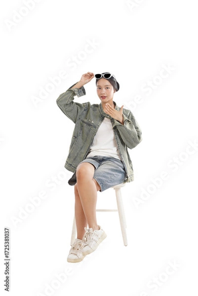 Obraz Casual Confidence: A stylish individual, radiating a sense of casual confidence, showcases a modern, urban aesthetic against a clean backdrop. 