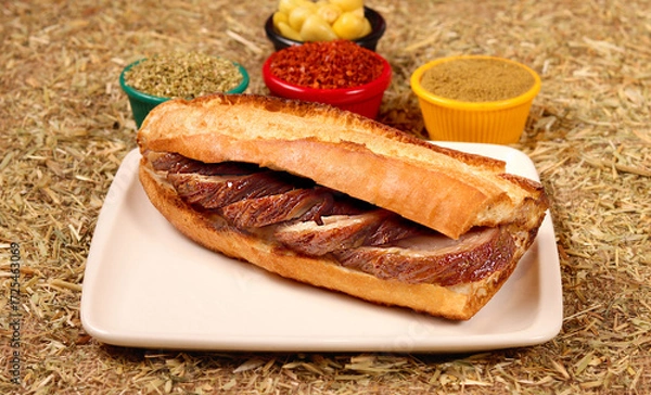 Obraz a photo of a fried kokorech sandwich,close up