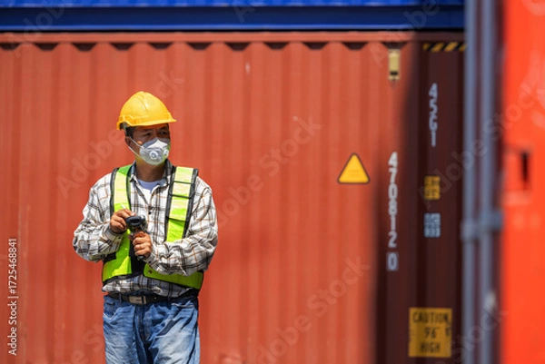Fototapeta Foreman or worker work at Container cargo site check up goods in container. Foreman or worker checking on shipping containers. Logistics and shipping